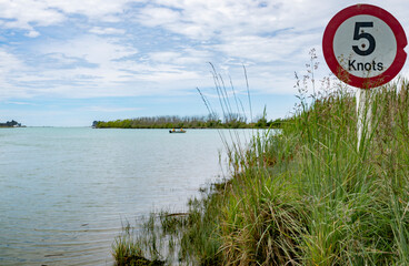 5 Knot speed limit sign on river bank