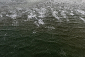 Textured background view of arctic ocean in northern Manitoba, Canada, before the ie has fully frozen for the winter on Hudson Bay.