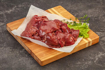 Raw chicken liver over board
