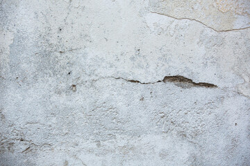 Obraz premium Texture of the old wall with peeling paint, plaster with cracks. Texture backround.