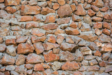 Texture of a wall from an old stone close-up. Background