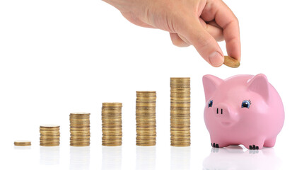 Savings. Investment concept with coins and a peggy bank Isolated on white background