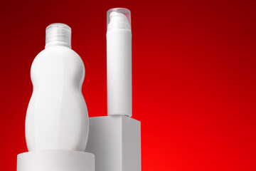 Blank cosmetic skincare container against red background