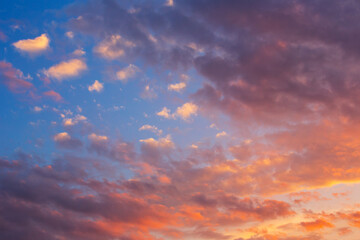 Naklejka na ściany i meble Blue orange sunset with clouds.