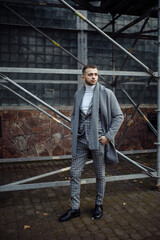 Fototapeta premium Full length body size photo ofcurious young man in stylish outfit wearing plaid suit grey coat scarf 
