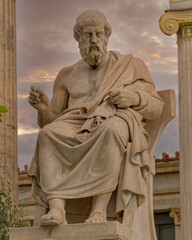 Plato the ancient Greek philosopher statue under dramatic sky, Athens Greece