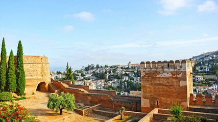 Fototapeta na wymiar Panoramic view of Albaicin neighborhood from the towers of Alcazaba. Palace of Alhambra in Granada, World Heritage Site by Unesco. Andalusia, Spain