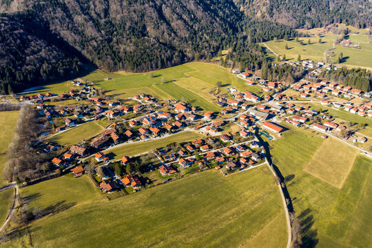 Germany, Bavaria, Schleching, Helicopter view of alpine town in summer
