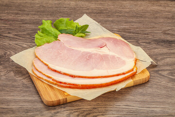 Sliced pork belly over board