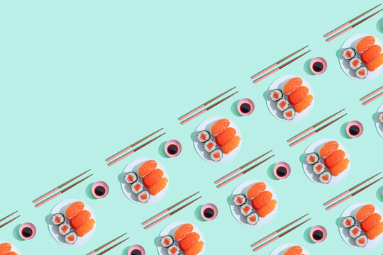 Pattern of plates of sushi against green background