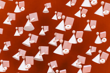 Geometric shapes hovering against red background