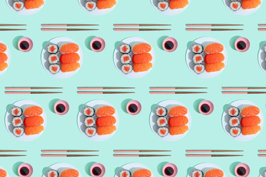 Pattern of plates of sushi against green background