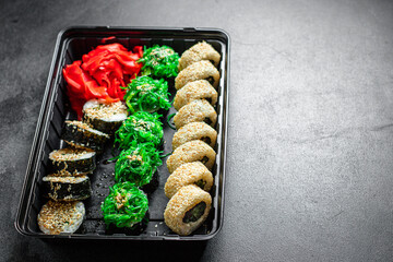 sushi rolls set salmon, trout, tuna, tobiko caviar, nori and more natural organic snack ready to eat on the table healthy meal snack ingredient top view copy space for text food background rustic