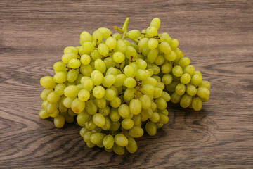 Green grape branch over background