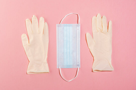 Studio shot of&Ocirc;&oslash;&Omega;protective face mask and pair of surgical gloves