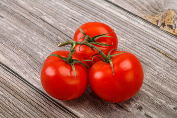 Red bright ripe tomato branch