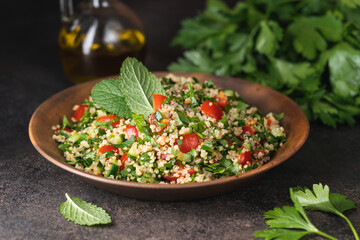 Quinoa salad with parsley, cucumber and cherry tomatoes. Tabbouleh Traditional middle eastern or arab dish