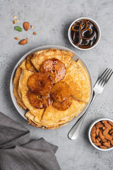 Traditional French thin pancakes crêpe suzette with orange sauce. Morning breakfast dessert