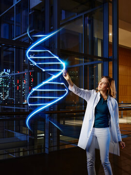 Female doctor light painting DNA in laboratory at hospital