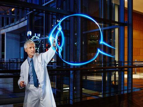 Male doctor examining eyeball at laboratory in hospital
