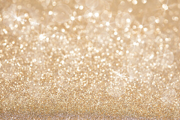 Golden Christmas lights with sparkling and twinkling bokeh. Gold xmas background