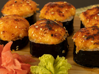 Rolls, on a wooden board black background
