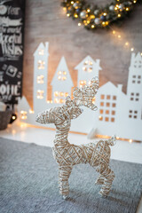 new year's interior, decorations, toy deer on the background of bokeh