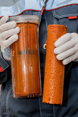 Water filtration - the plumber changes the dirty water filter. Cleaning of tap water