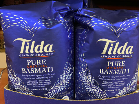 Viersen, Germany - October 8. 2020: Close up of Tilda pure basmati rice packets in shelf of german supermarket