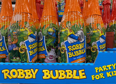 Viersen, Germany - October 8. 2020: Close up of Robby Bubble kids drink bottles in shelf of german supermarket (focus mainly on yellow text below)