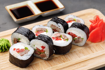 Maki sushi roll served on plate close up