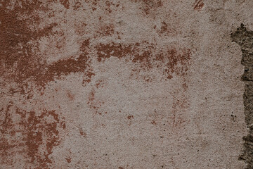 Damaged white and red painted stone wall with peeled and weathered structure, space for text on background