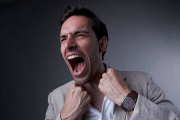 Handsome corporate businessman yelling