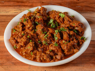Tawa mutton fry or tawa gosht is authentic spicy lamb dish.Cooked with spices,served over a rustic...