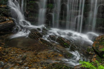 Fototapeta na wymiar Waterfall on Divoky creek near Kouty nad Desnou village in summer day