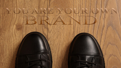 Top View of Business Shoes on the floor with the text: You Are Your Own Brand