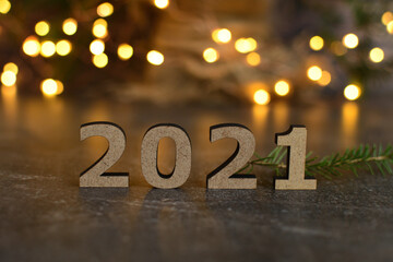 wooden numbers 2021 and festive background . The concept of atmosphere the new year.Festive Winter Holidays concept..DIY gifts, eco decor.Selective focus. copy space