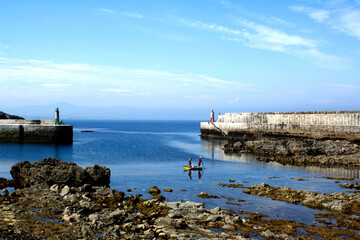 small boat sailing in a beautiful blue scenic in the sea