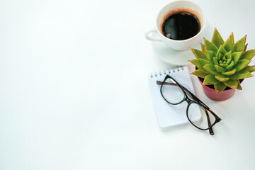 computer, succulent, glasses, Notepad, coffee Cup on a white background. office theme . job. top view