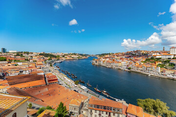 Fototapeta na wymiar Picturesque cityscape image of Porto (Oporto), Portugal with the famous Luis I Bridge and the Douro River.