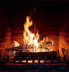 Fireplace, fire burning, cozy warm fireside, christmas home.