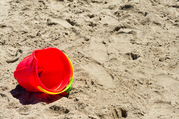 Copyspace of red bucket in the sand