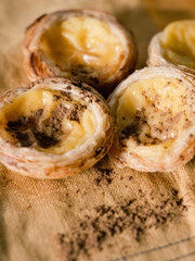 Pasteis de nata on yellow backdrop