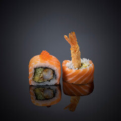 Japanese sushi on a gray-black background.
