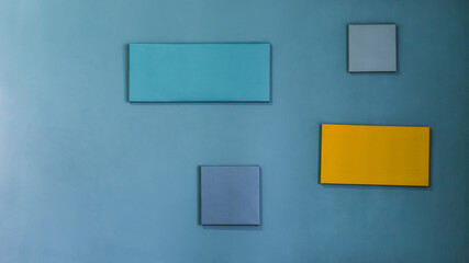 4 Empty frame isolated on blue cement wall.