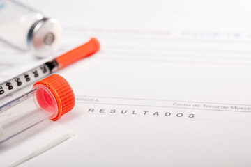 SARS COV-2 (covid-19) antigen detection test, transport vial with orange closure and swab, syringe and vaccine vial on laboratory report (text results).