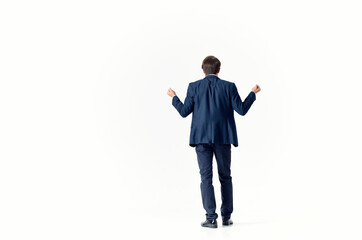 business man puzzled look light background suit gesturing with hands finance and work model