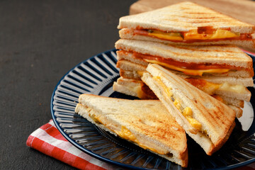 Stack of triangle sandwiches in plate close up