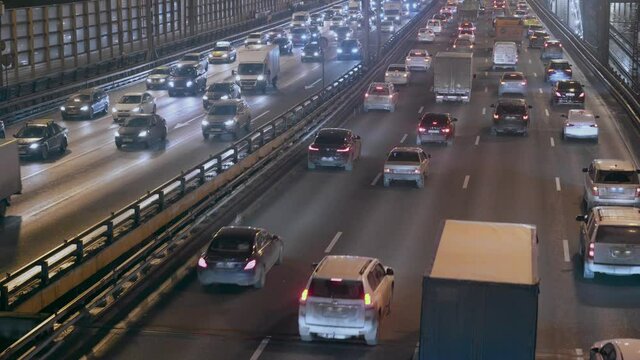Car traffic on the Andreevsky bridge over the Moscow river at night in Moscow, Russia 27.11.2020