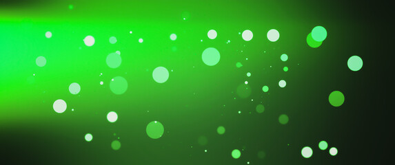 Blurred Green bokeh background with copy space. Abstract luxury glitter effect boke. Sparkling magical dust particles. Magic concept, defocused .